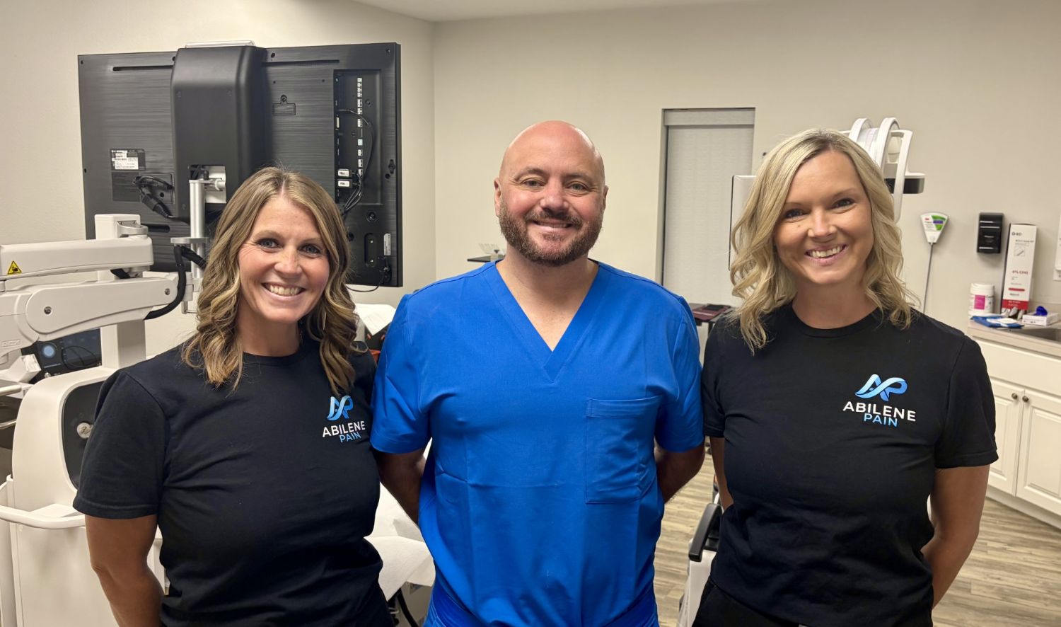 Dr. Nicolas Pugh with clinical staff in the Abilene Pain in-office procedure suite